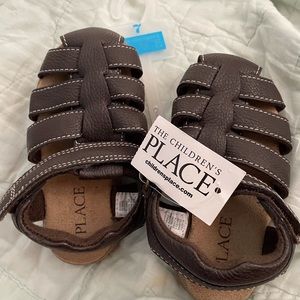 Children place brown shoes